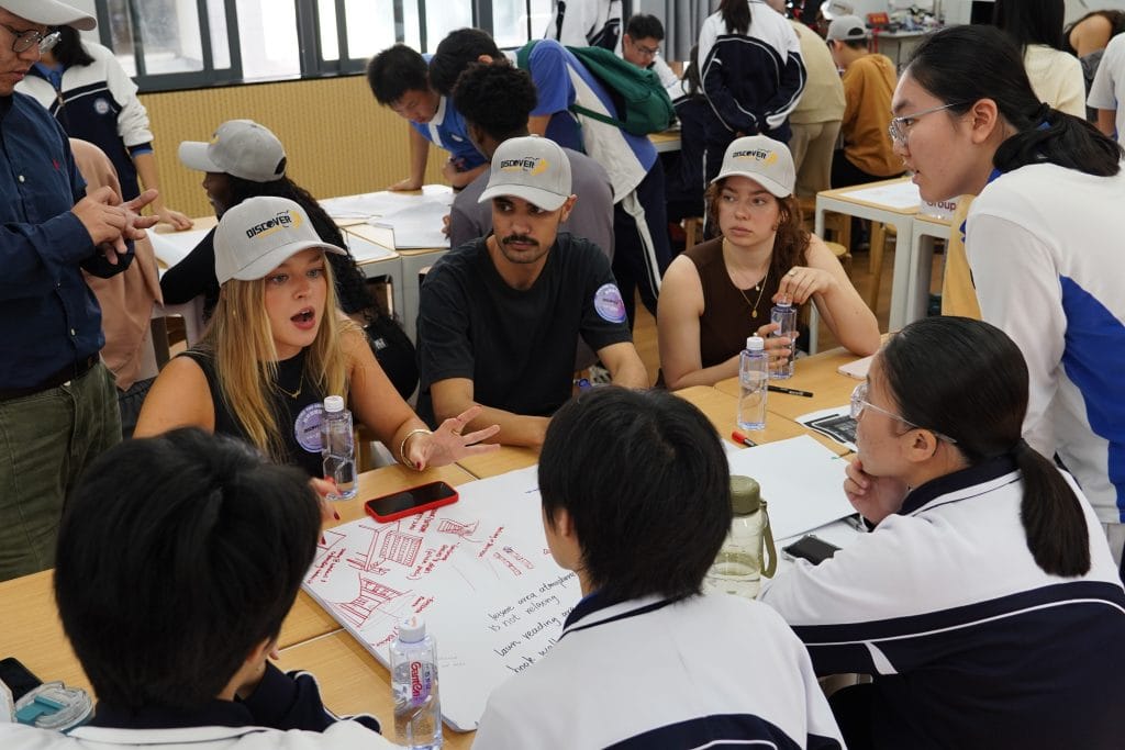 international students studying together with radioguide